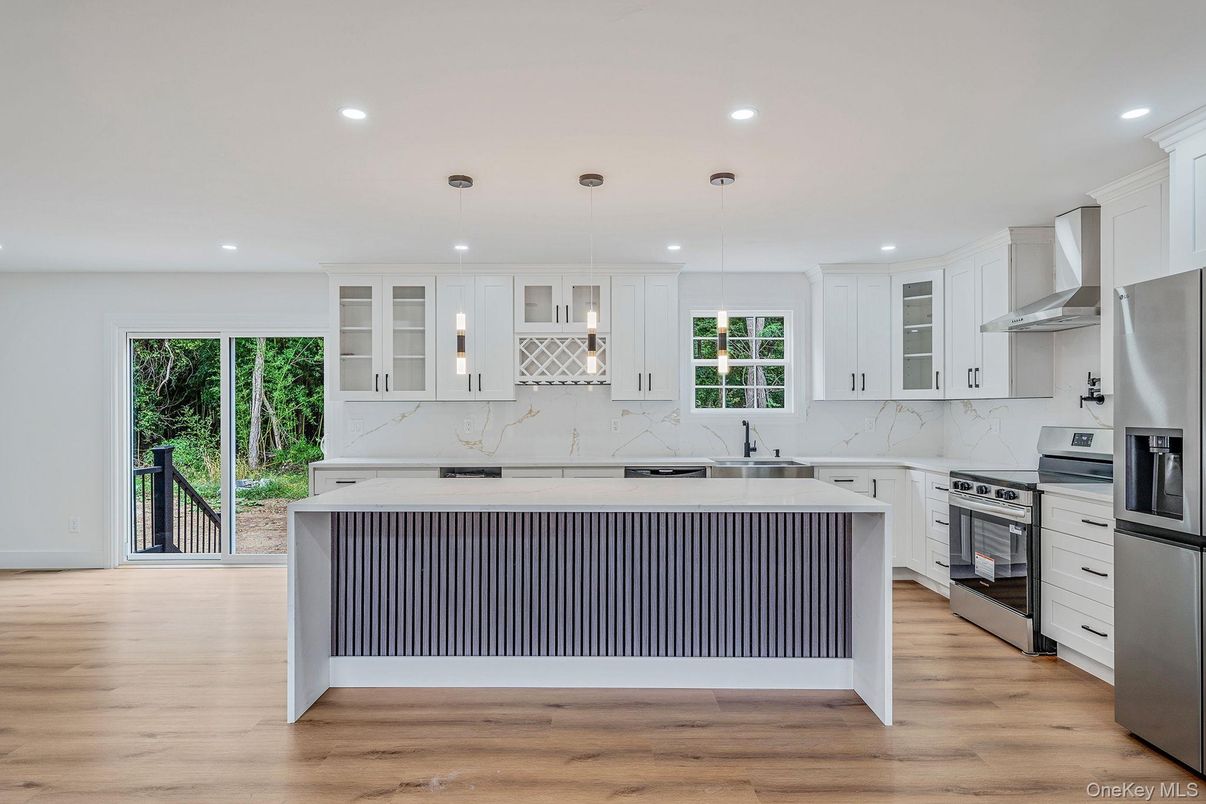 Interior, Kitchen, Marble Walls, Pendant Lights, Recessed Lighting, Stainless Steel Appliances, Wood Texture Flooring