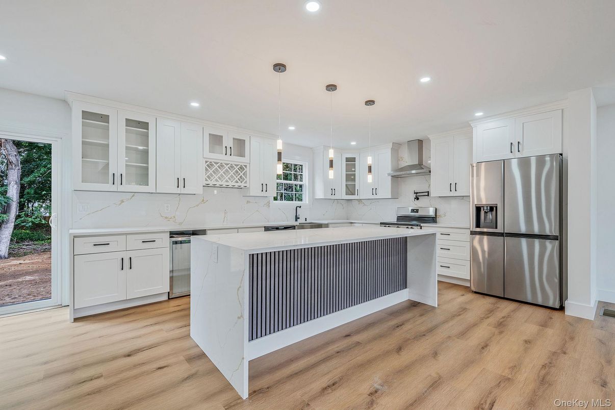 Interior, Kitchen, Marble Walls, Pendant Lights, Recessed Lighting, Stainless Steel Appliances, Wood Texture Flooring