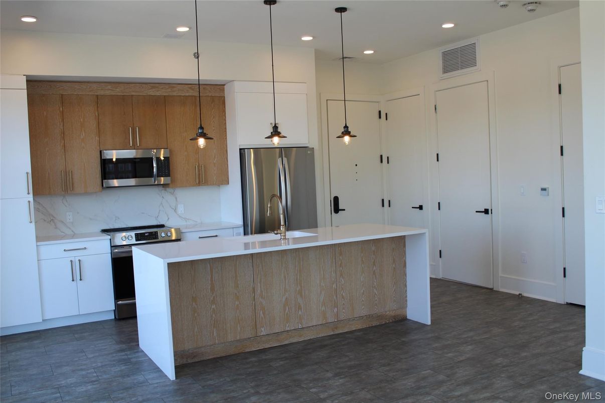 Interior, Kitchen, Marble Walls, Pendant Lights, Recessed Lighting, Stainless Steel Appliances