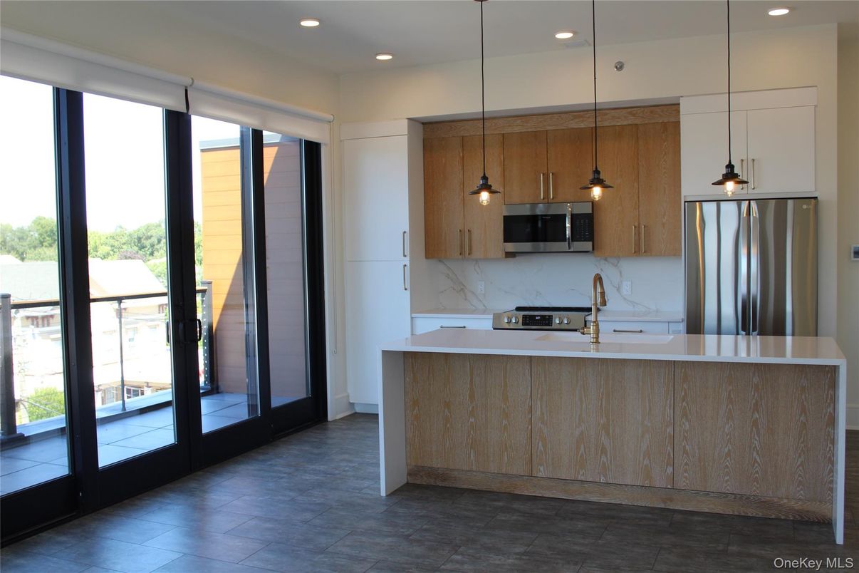 Interior, Kitchen, Marble Walls, Pendant Lights, Recessed Lighting, Stainless Steel Appliances