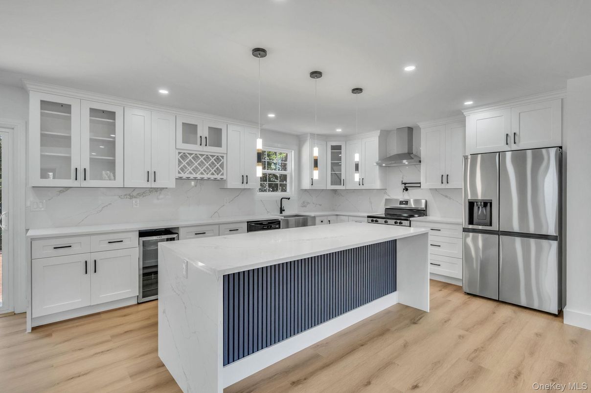 Interior, Kitchen, Marble Walls, Pendant Lights, Recessed Lighting, Stainless Steel Appliances, Wood Texture Flooring