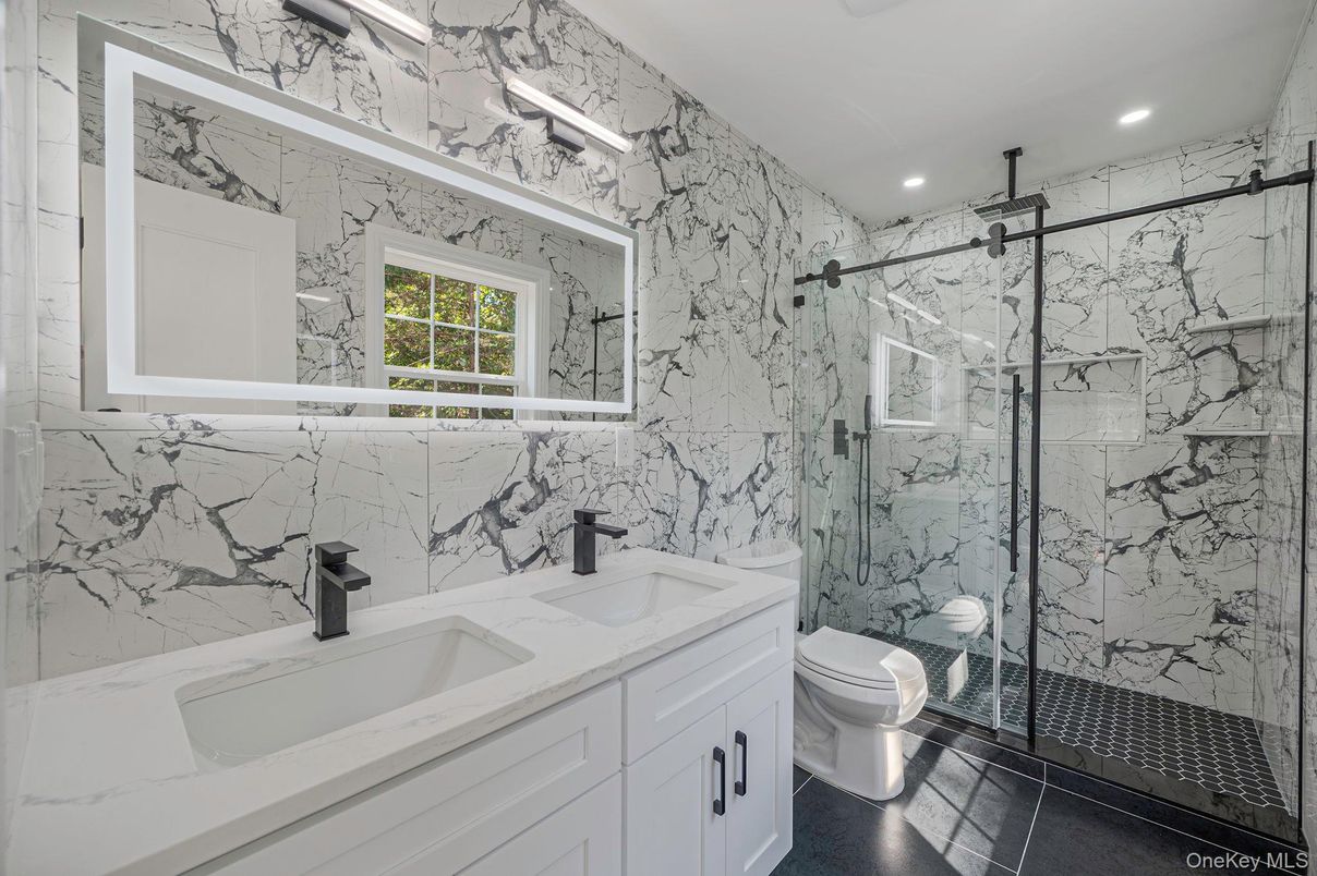 Bathroom, Dual Sink Vanities, Glass Shower, Interior, Marble Walls, Recessed Lighting