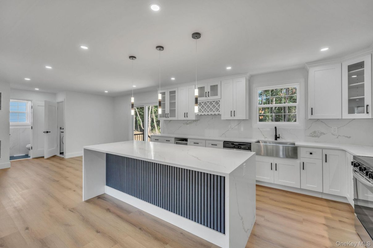 Interior, Kitchen, Marble Walls, Pendant Lights, Recessed Lighting, Stainless Steel Appliances, Wood Texture Flooring