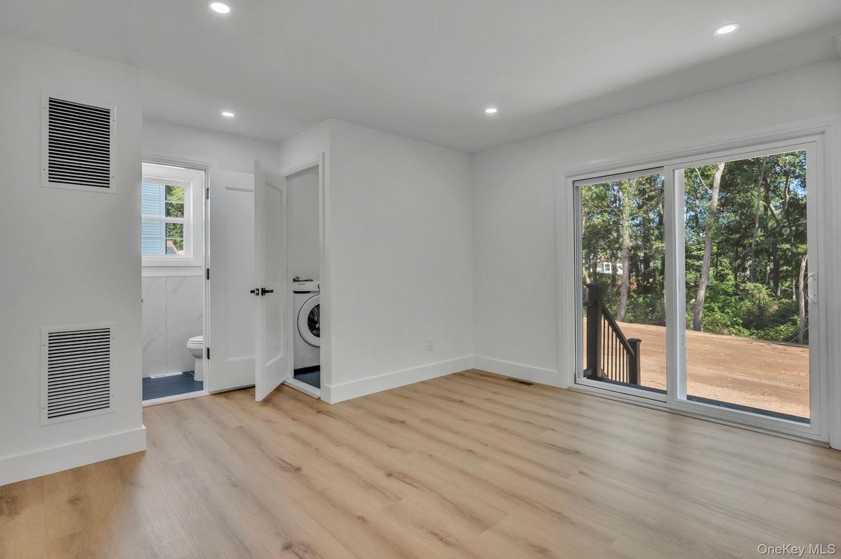 Empty room, Interior, Recessed Lighting, Utility Closets, Washer, Wood Texture Flooring