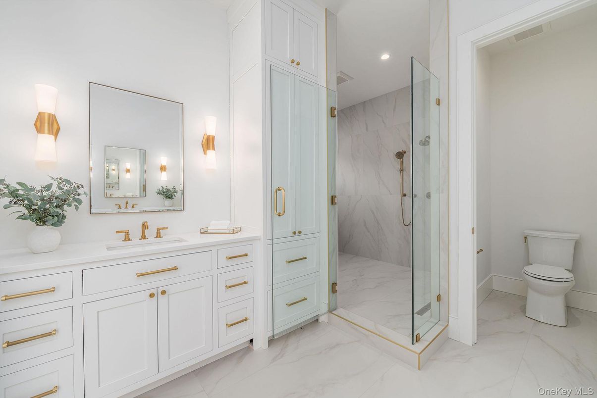 Bathroom, Dual Sink Vanities, Glass Shower, Interior, Marble, Marble Walls, Recessed Lighting