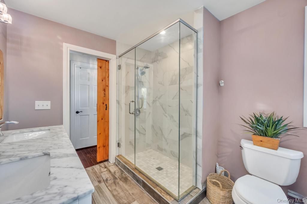 Bathroom, Glass Shower, Interior, Marble, Marble Walls, Recessed Lighting, Wood Texture Flooring