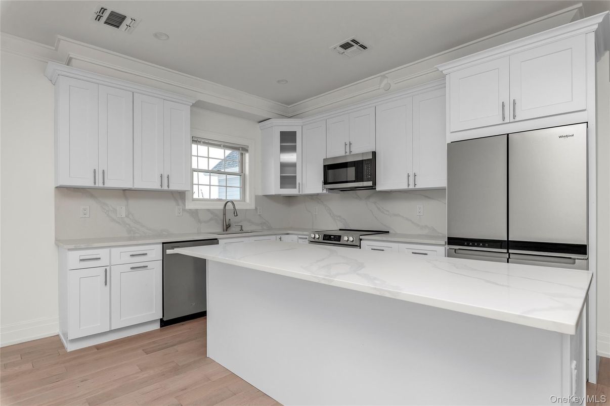 Interior, Kitchen, Marble Walls, Recessed Lighting, Stainless Steel Appliances, Wood Texture Flooring