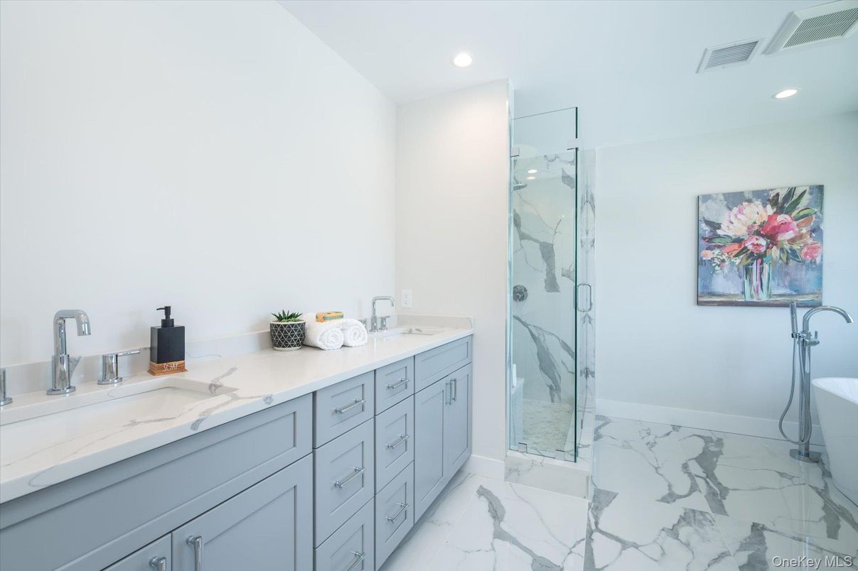 Bathroom, Dual Sink Vanities, Glass Shower, Interior, Marble, Marble Walls, Recessed Lighting