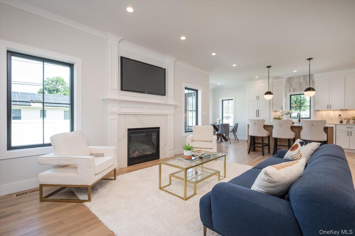 Dining room, Fireplace, Interior, Living room, Pendant Lights, Recessed Lighting, Wood Texture Flooring