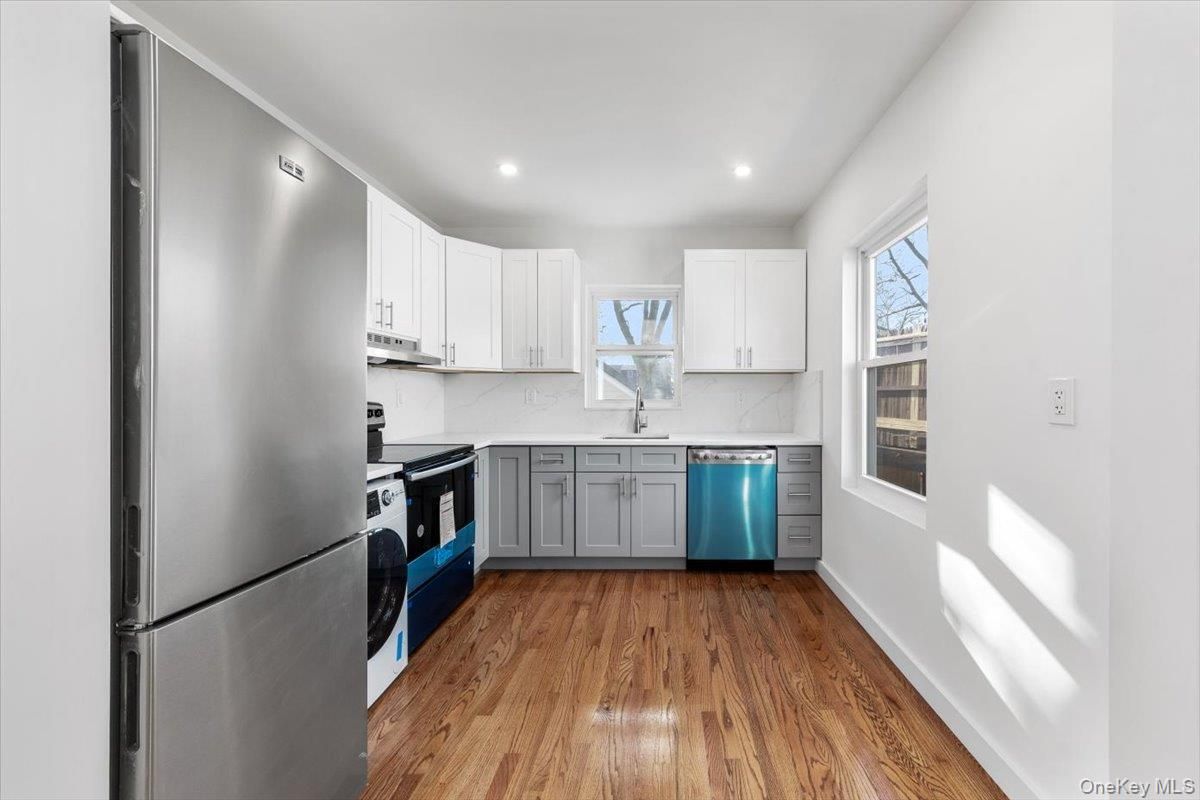Interior, Kitchen, Recessed Lighting, Washer, Wood Texture Flooring
