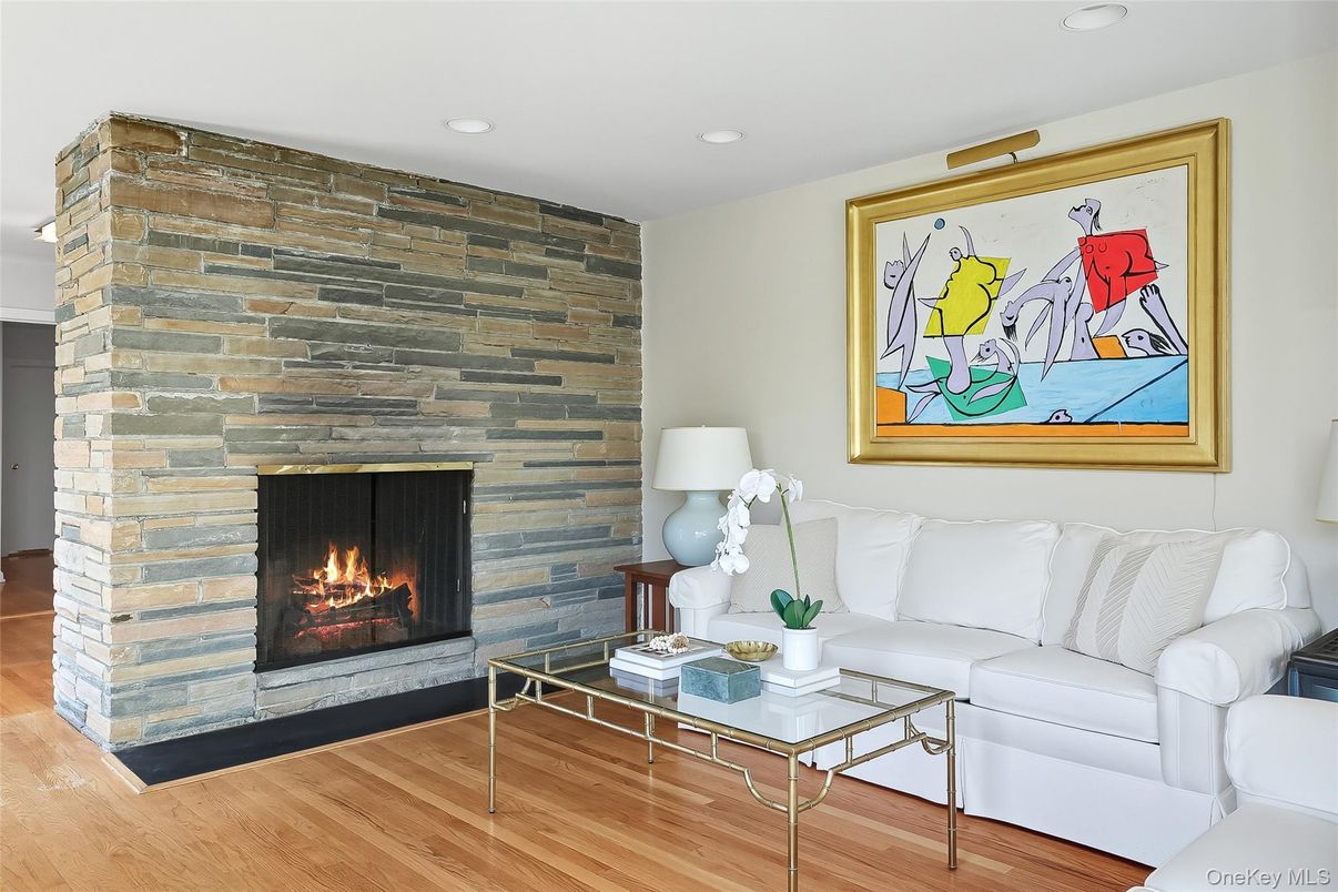 Fireplace, Interior, Living room, Recessed Lighting, Stone Walls, Wood Texture Flooring