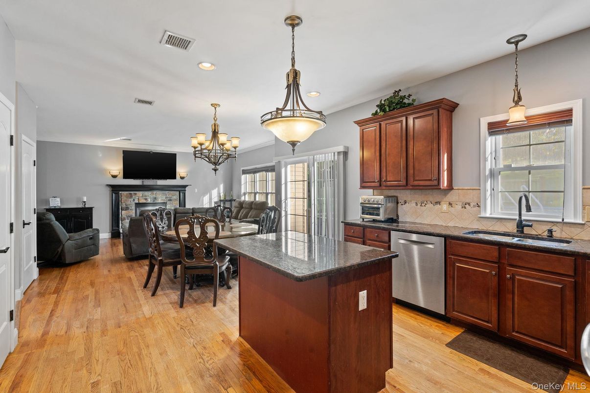 Chandelier, Dining room, Fireplace, Interior, Kitchen, Living room, Pendant Lights, Recessed Lighting, Wood Texture Flooring