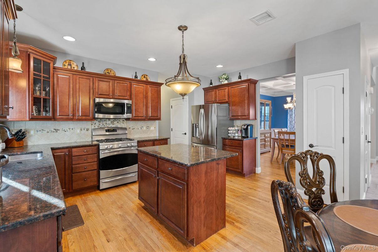 Dining room, Interior, Kitchen, Pendant Lights, Recessed Lighting, Stainless Steel Appliances, Wood Texture Flooring