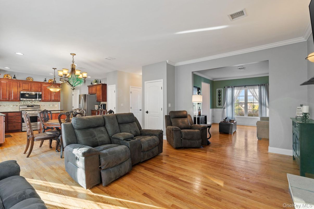 Chandelier, Dining room, Interior, Kitchen, Living room, Recessed Lighting, Stainless Steel Appliances, Wood Texture Flooring