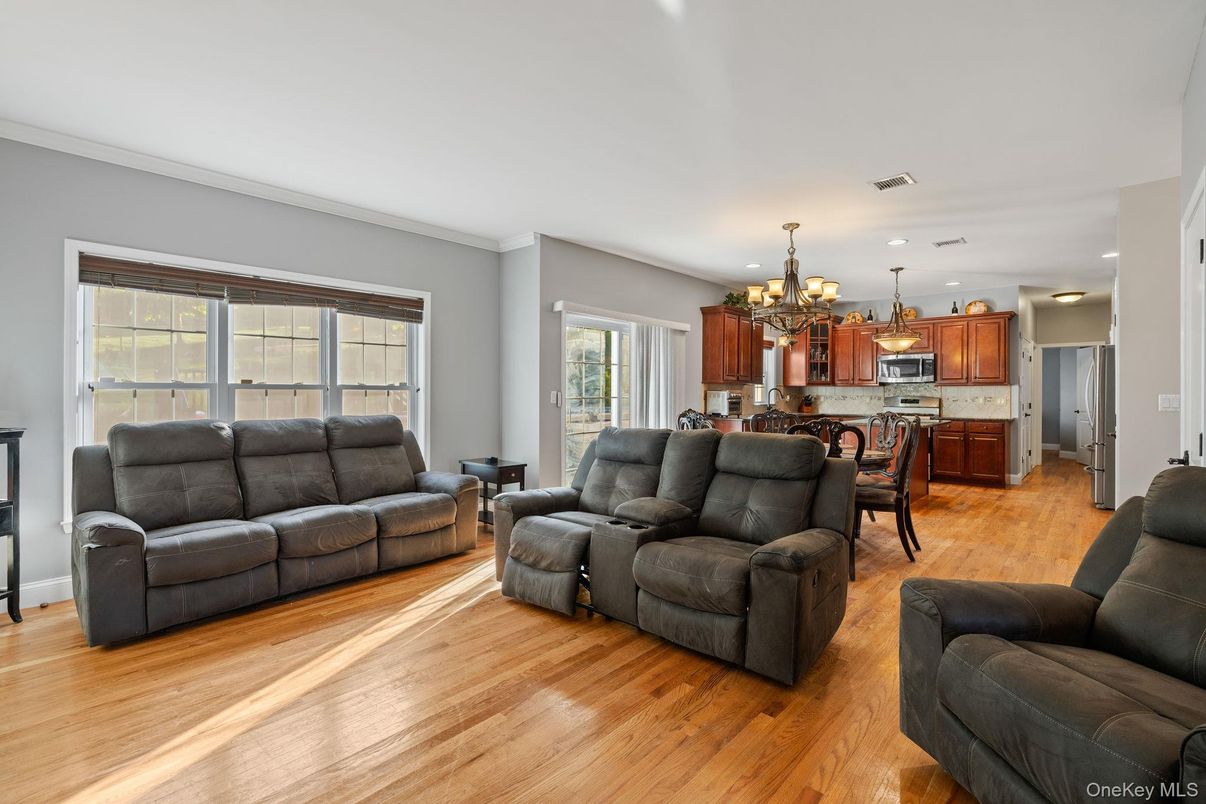 Chandelier, Dining room, Interior, Kitchen, Living room, Recessed Lighting, Stainless Steel Appliances, Wood Texture Flooring