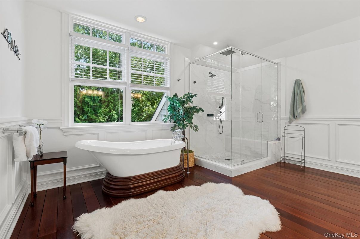 Bathroom, Free Standing Baths, Glass Shower, Interior, Marble Walls, Recessed Lighting, Wood Texture Flooring