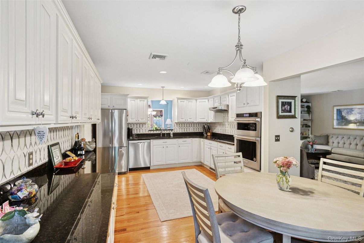 Dining room, Interior, Kitchen, Pendant Lights, Recessed Lighting, Stainless Steel Appliances, Wood Texture Flooring