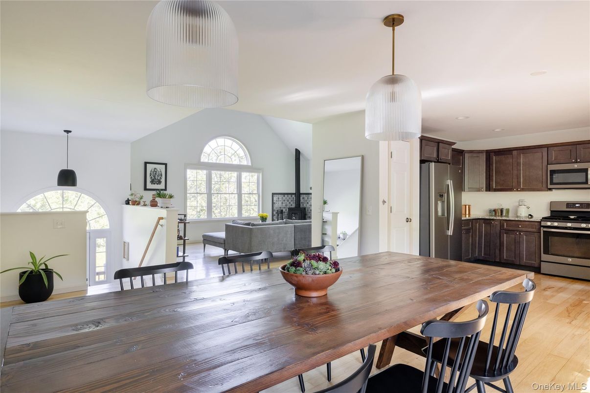 Dining room, Fireplace, Interior, Kitchen, Living room, Pendant Lights, Recessed Lighting, Stainless Steel Appliances, Wood Texture Flooring