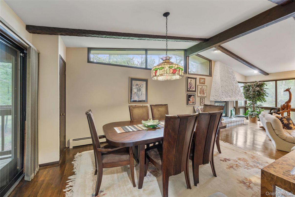 Dining room, Fireplace, Interior, Pendant Lights, Recessed Lighting, Wooden Beams, Wood Texture Flooring