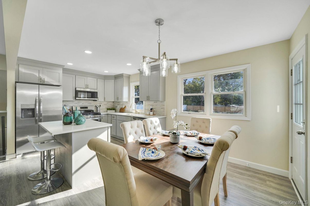 Dining room, Interior, Kitchen, Pendant Lights, Recessed Lighting, Stainless Steel Appliances, Wood Texture Flooring