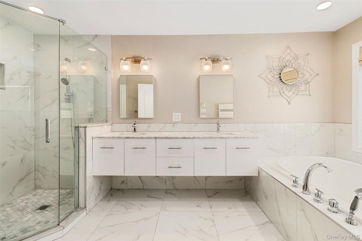 Bathroom, Dual Sink Vanities, Glass Shower, Interior, Marble, Marble Walls, Recessed Lighting