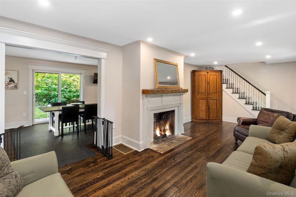 Dining room, Fireplace, Interior, Living room, Recessed Lighting, Wood Texture Flooring