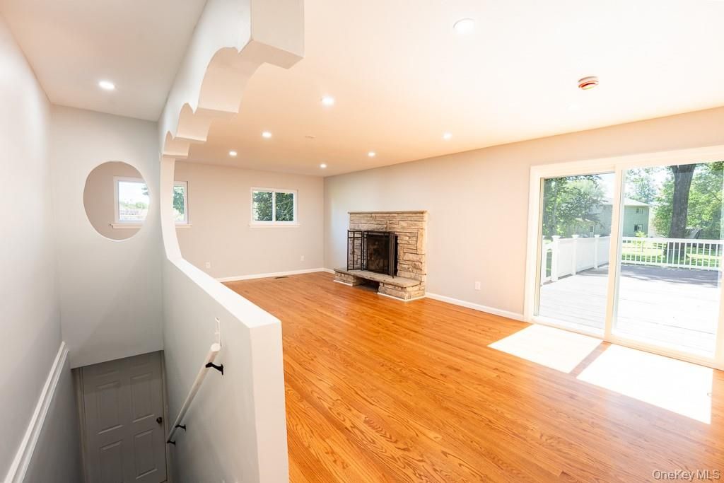 Empty room, Fireplace, Interior, Recessed Lighting, Wood Texture Flooring