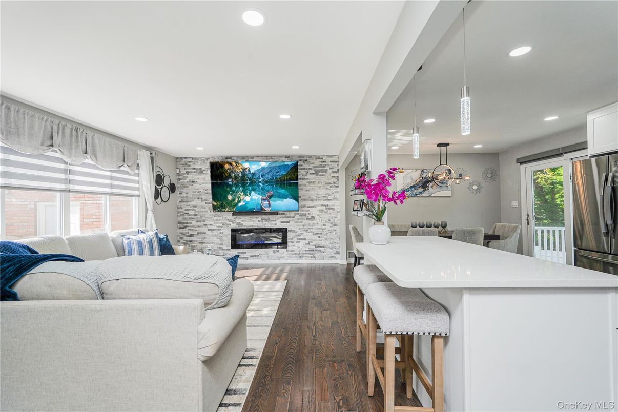 Dining room, Fireplace, Interior, Living room, Pendant Lights, Recessed Lighting, Stone Walls, Wood Texture Flooring