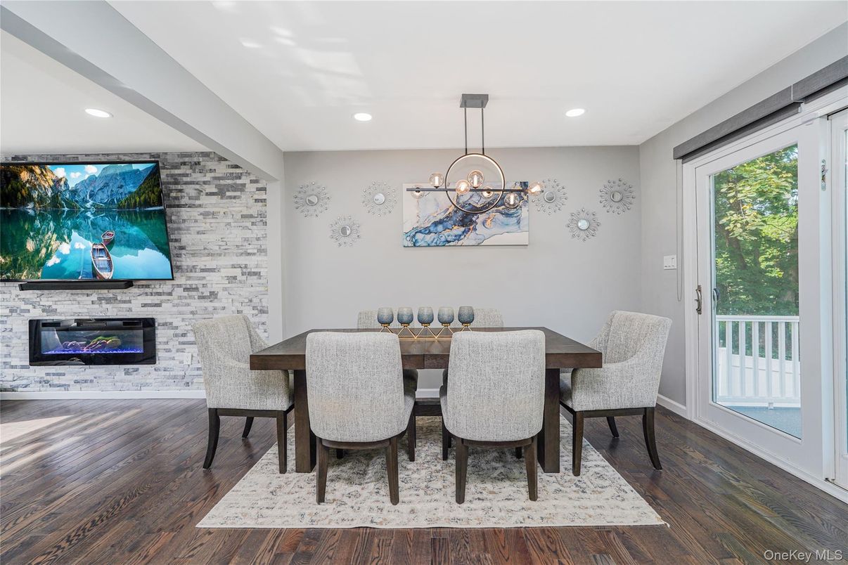 Dining room, Fireplace, Interior, Pendant Lights, Recessed Lighting, Stone Walls, Wood Texture Flooring