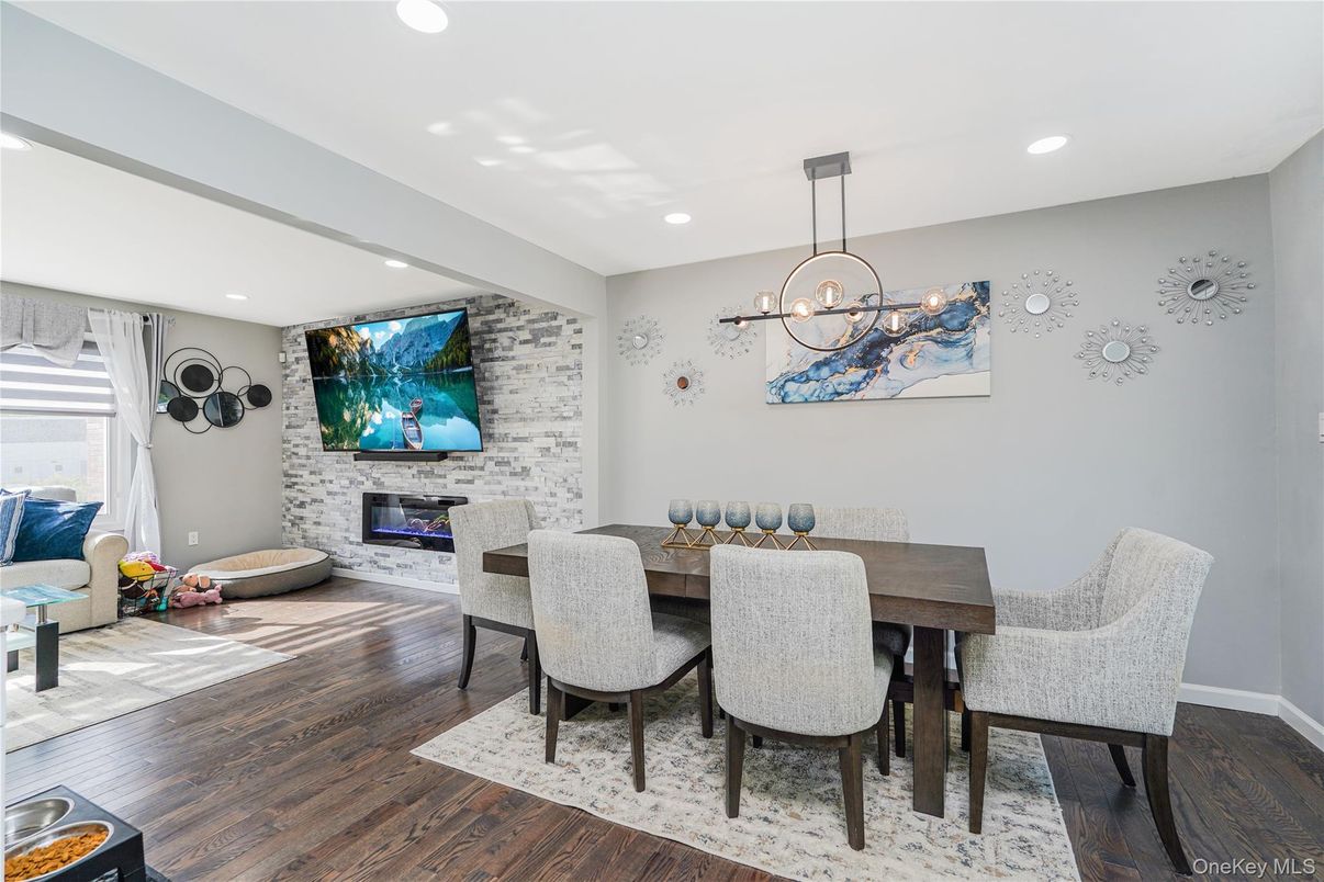 Dining room, Fireplace, Interior, Pendant Lights, Recessed Lighting, Stone Walls, Wood Texture Flooring