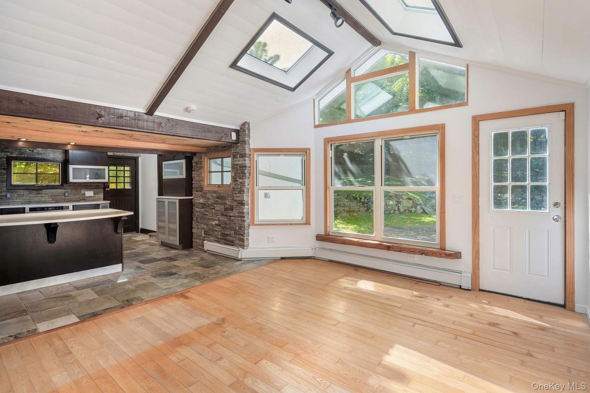Empty room, Fireplace, Interior, Kitchen, Stone Walls, Wooden Beams, Wood Texture Flooring