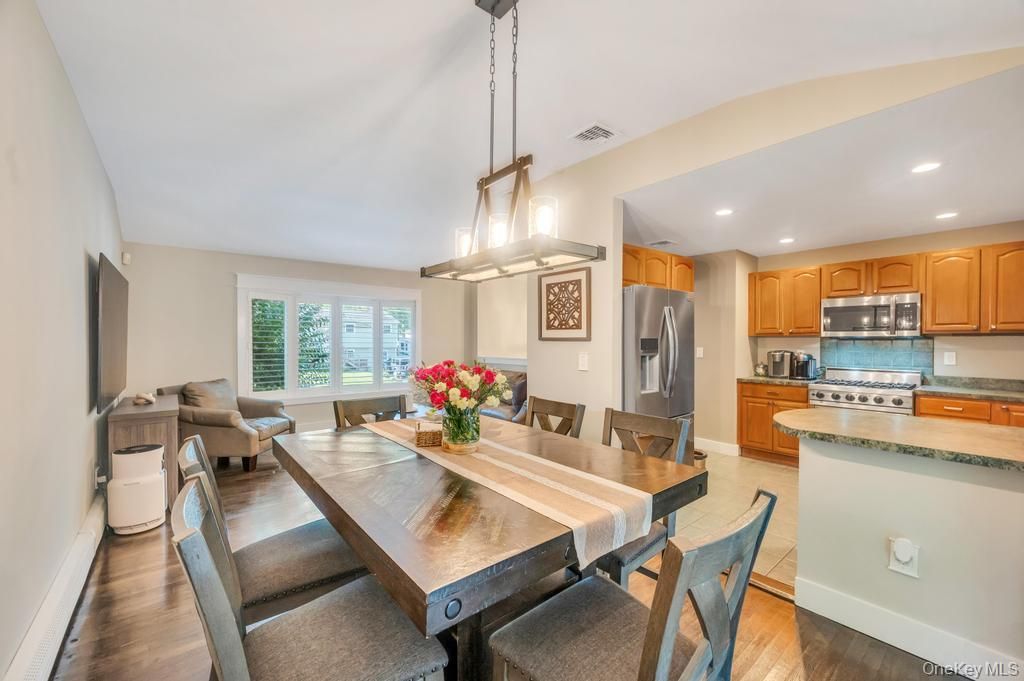 Dining room, Interior, Kitchen, Pendant Lights, Recessed Lighting, Stainless Steel Appliances, Wood Texture Flooring