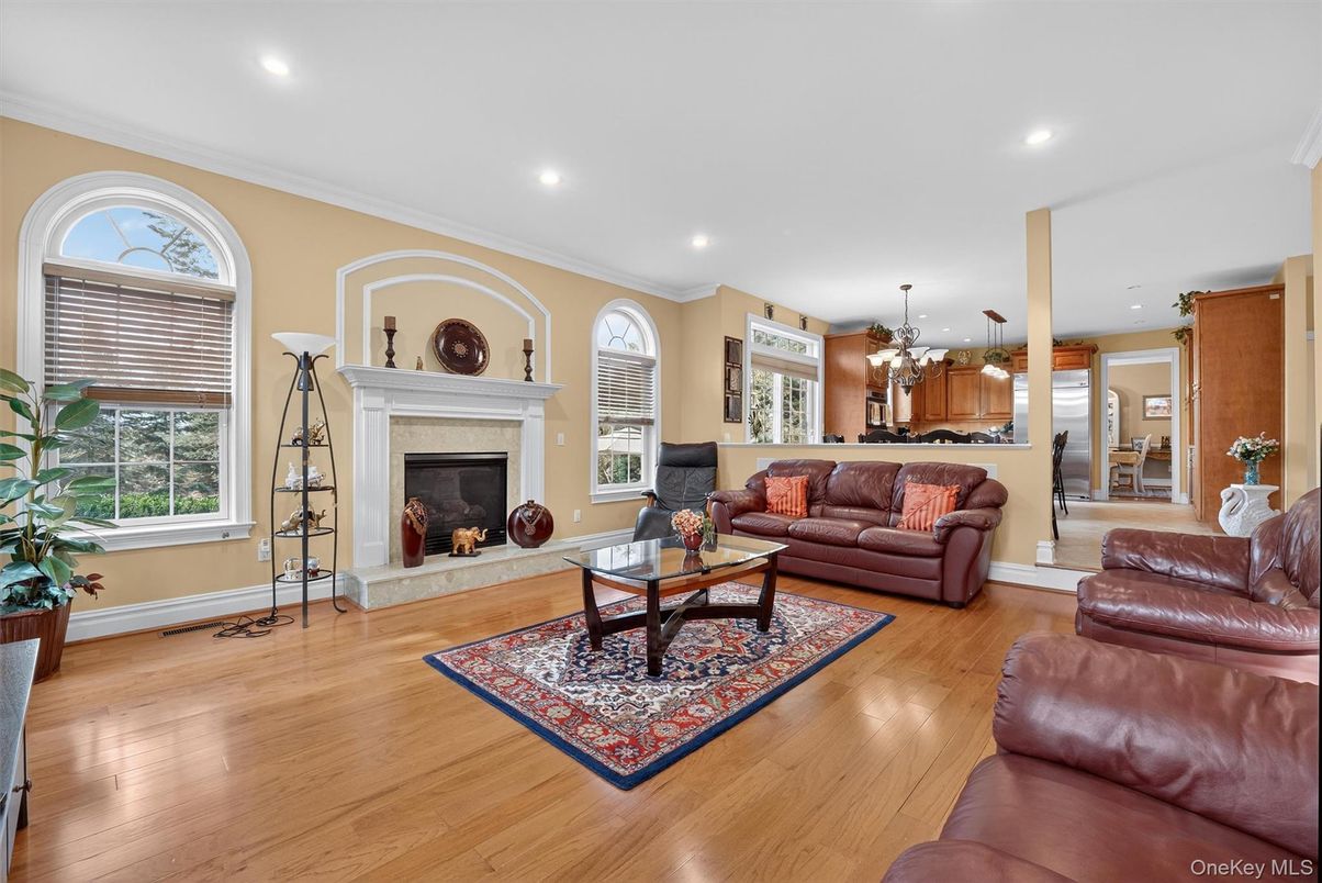 Chandelier, Dining room, Fireplace, Interior, Living room, Pendant Lights, Recessed Lighting, Wood Texture Flooring