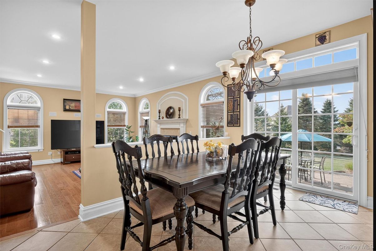 Chandelier, Dining room, Fireplace, Interior, Living room, Recessed Lighting, Wood Texture Flooring