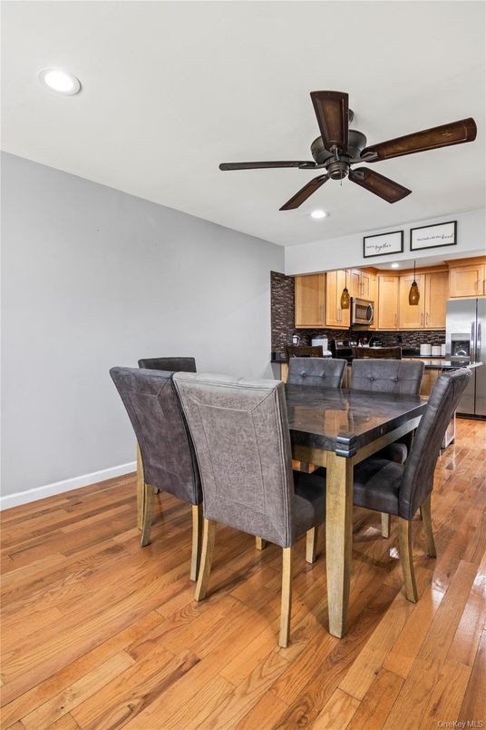 Dining room, Interior, Kitchen, Recessed Lighting, Stainless Steel Appliances, Wood Texture Flooring