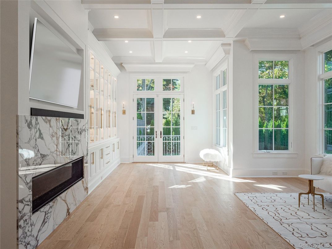 Fireplace, Interior, Marble Walls, Recessed Lighting, Wood Texture Flooring