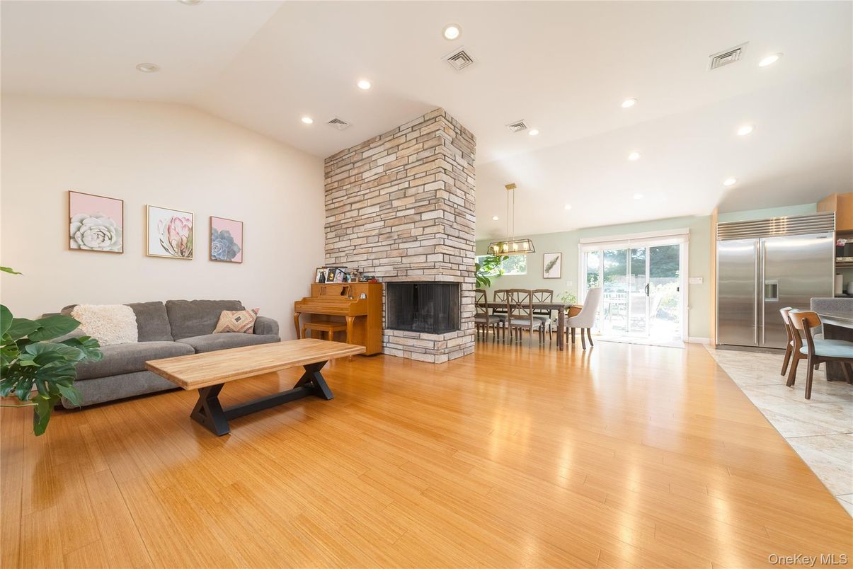 Dining room, Fireplace, Interior, Kitchen, Living room, Pendant Lights, Recessed Lighting, Stainless Steel Appliances, Stone Walls, Wood Texture Flooring