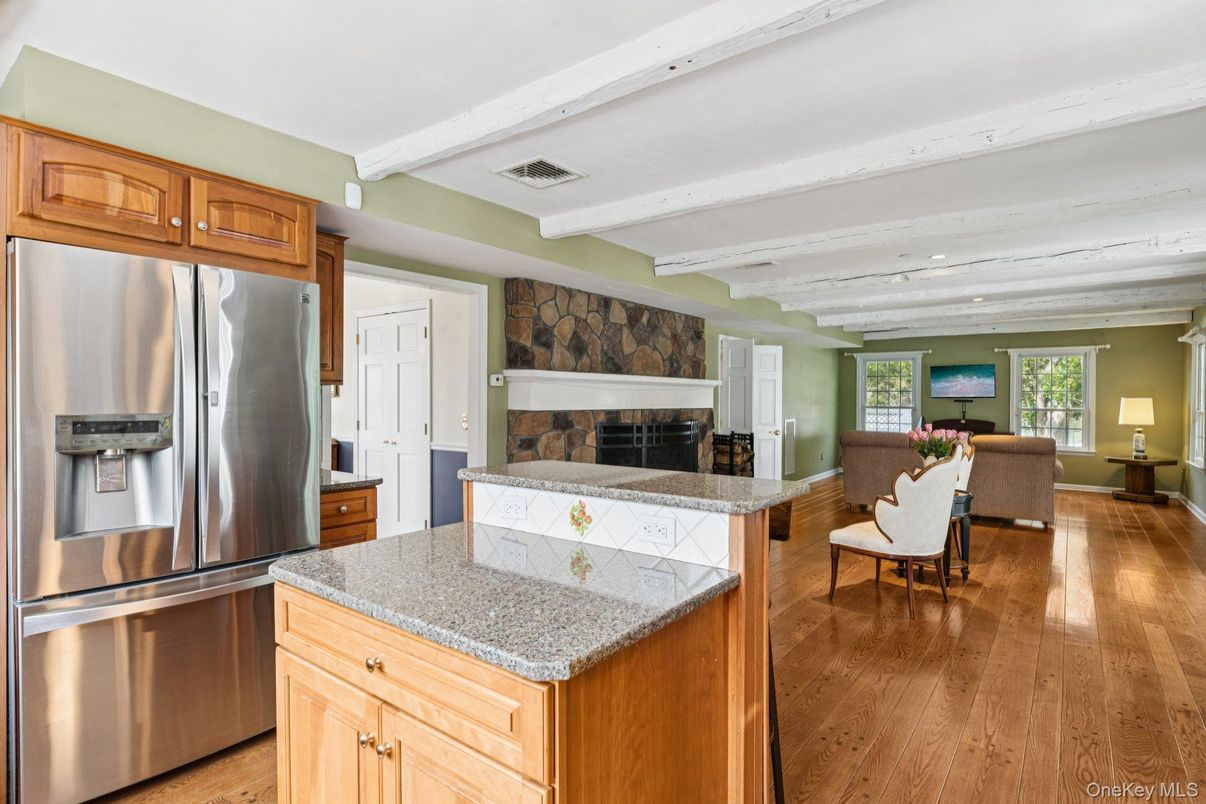 Dining room, Fireplace, Interior, Kitchen, Living room, Recessed Lighting, Stainless Steel Appliances, Wood Texture Flooring