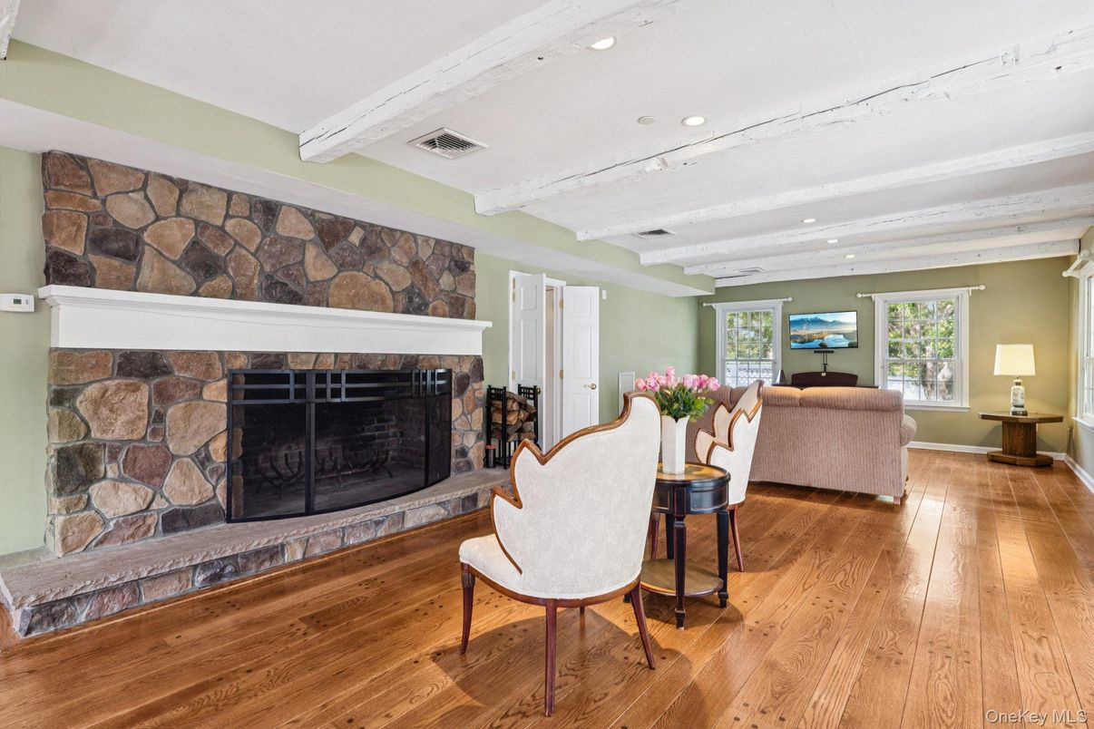 Fireplace, Interior, Living room, Recessed Lighting, Stone Walls, Wood Texture Flooring