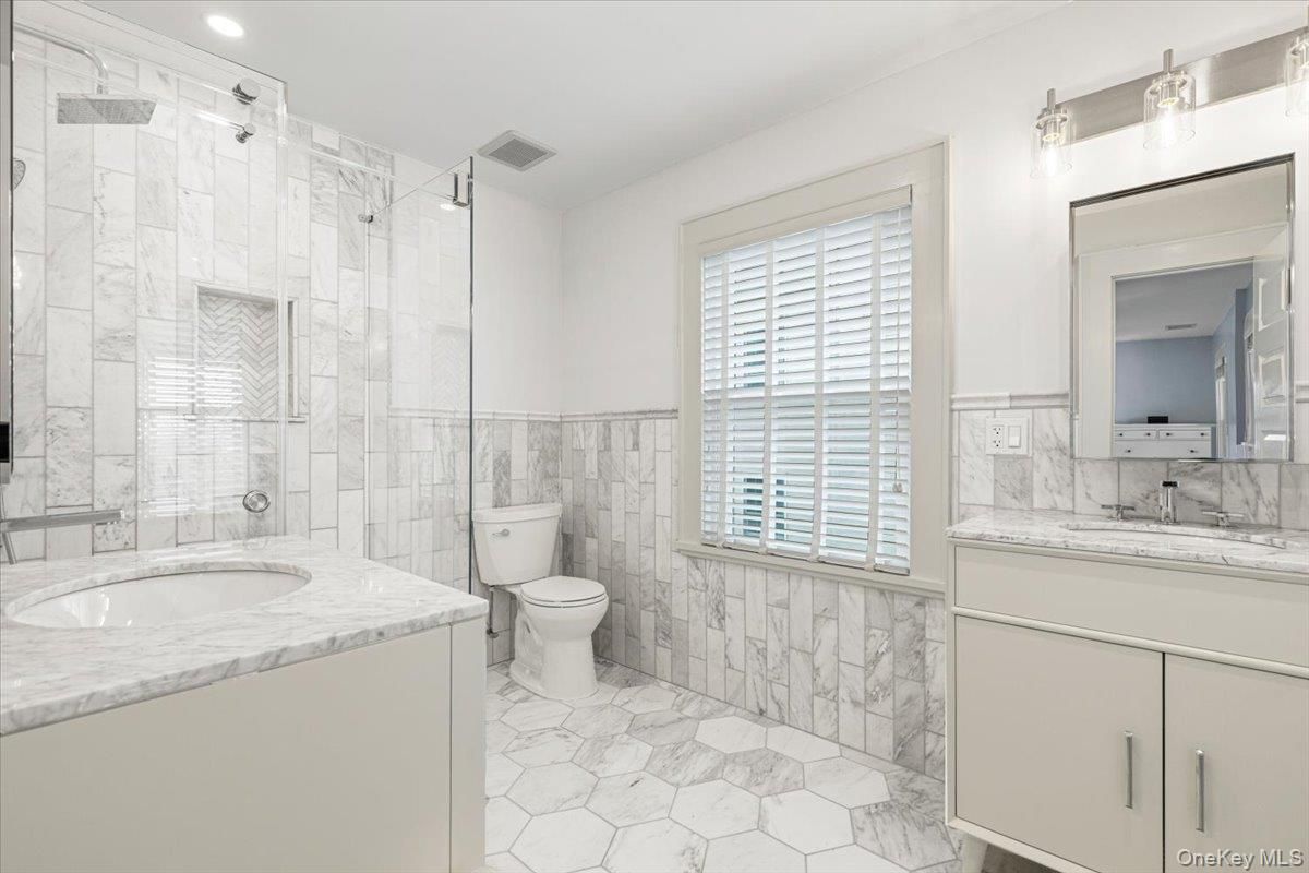 Bathroom, Dual Sink Vanities, Glass Shower, Interior, Marble, Marble Walls, Recessed Lighting