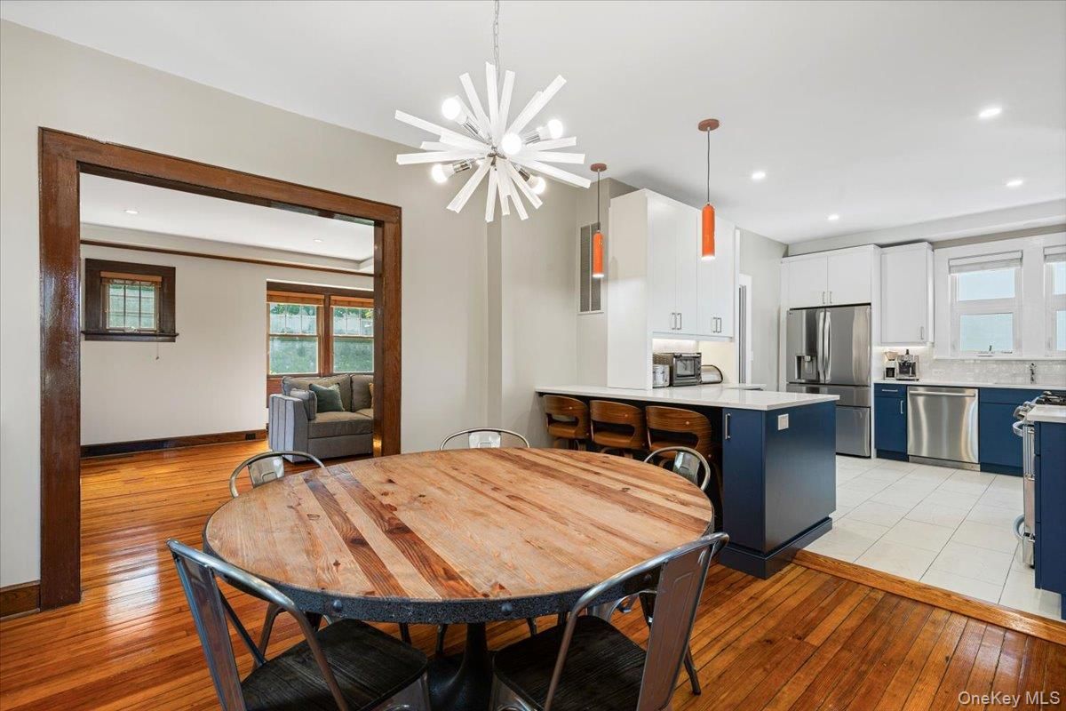 Dining room, Interior, Kitchen, Pendant Lights, Recessed Lighting, Stainless Steel Appliances, Wood Texture Flooring