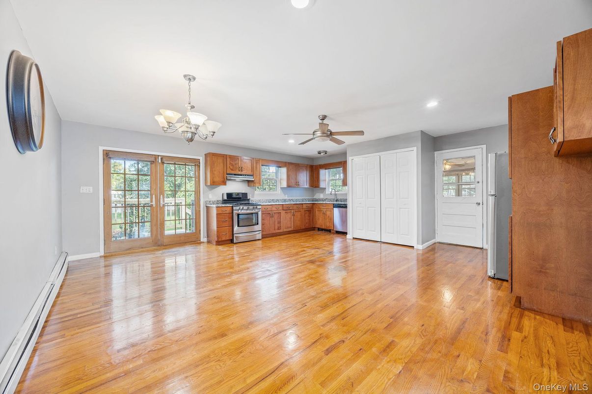 Chandelier, Empty room, Interior, Kitchen, Recessed Lighting, Stainless Steel Appliances, Wood Texture Flooring