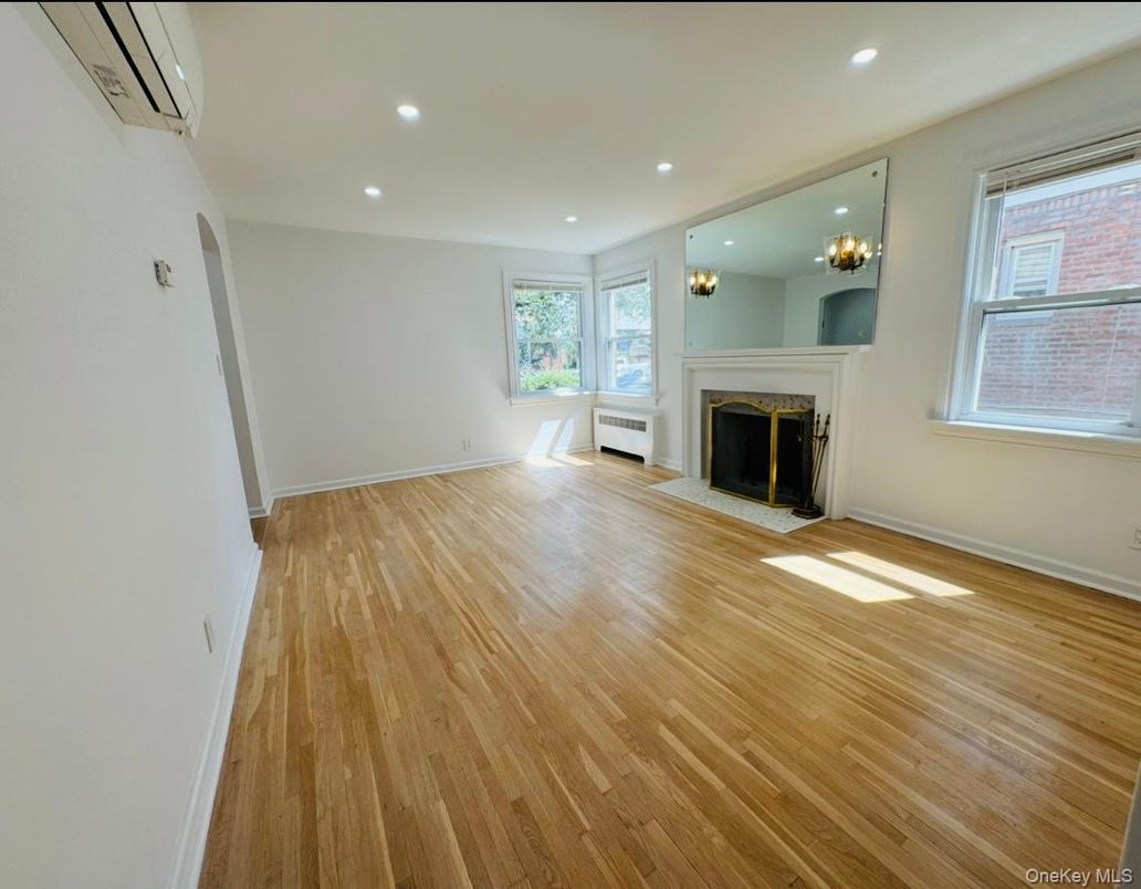 Chandelier, Empty room, Fireplace, Interior, Recessed Lighting, Wood Texture Flooring
