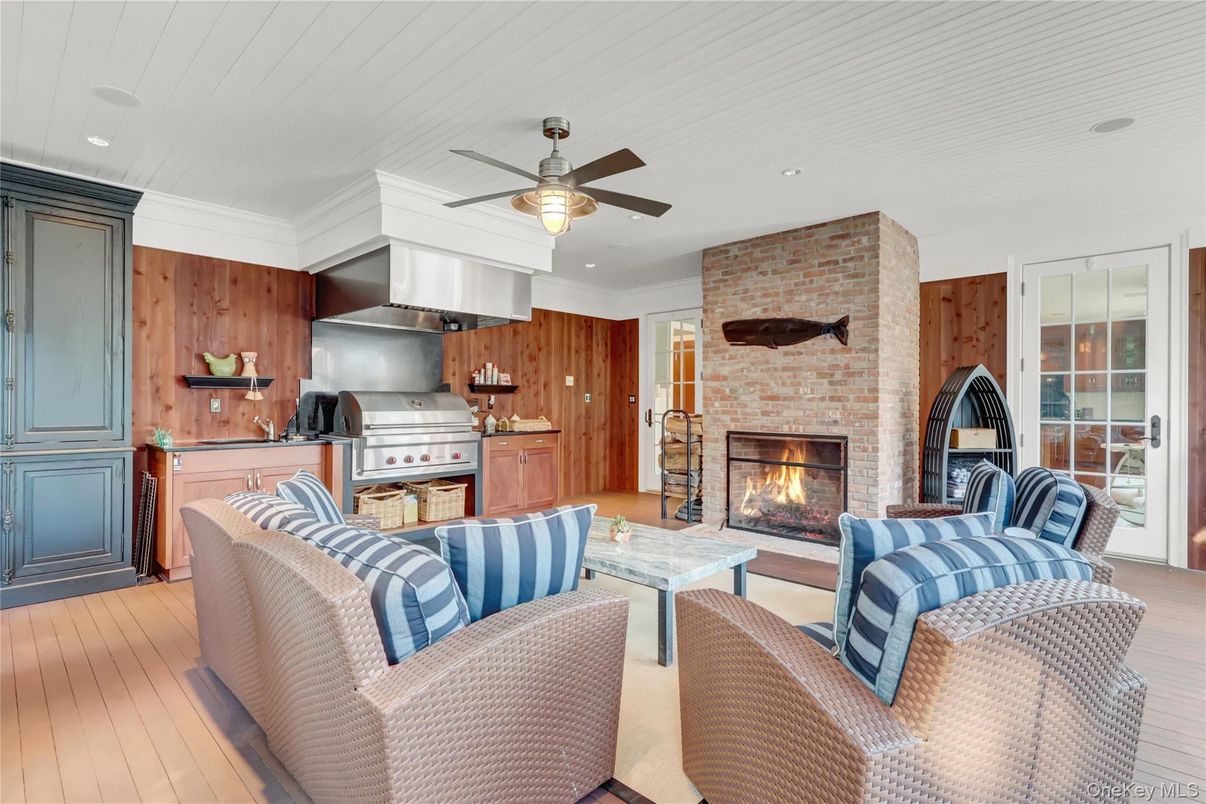Fireplace, Interior, Kitchen, Living room, Recessed Lighting, Stainless Steel Appliances, Stone Walls, Wood Texture Flooring, Wooden Walls