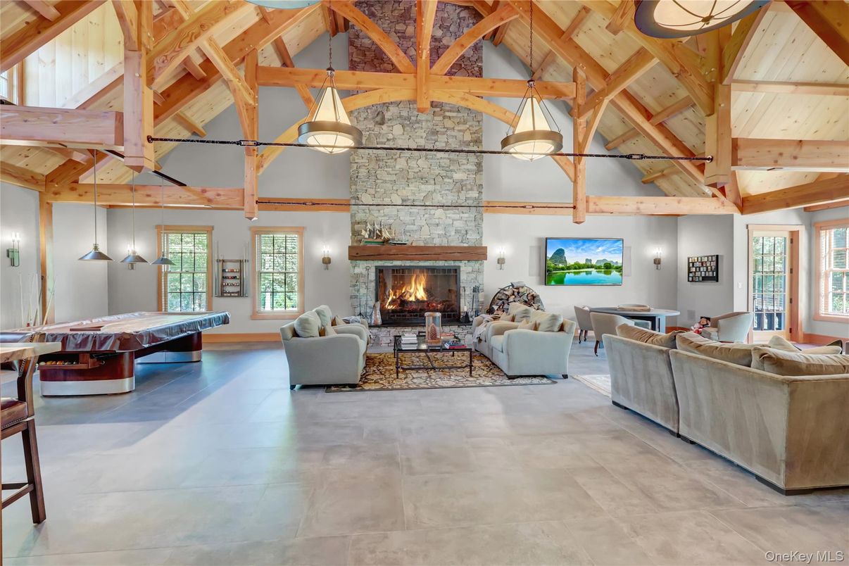 Billiard Table, Fireplace, Game Room, Interior, Living room, Pendant Lights, Stone Walls, Wooden Beams, Wooden Ceilings