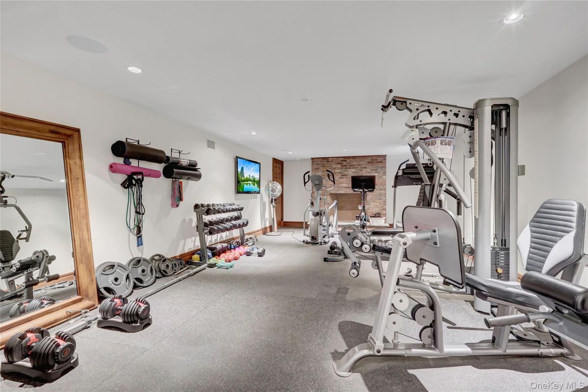 Fireplace, Fitness Equipment, Gym, Interior, Recessed Lighting, Stone Walls