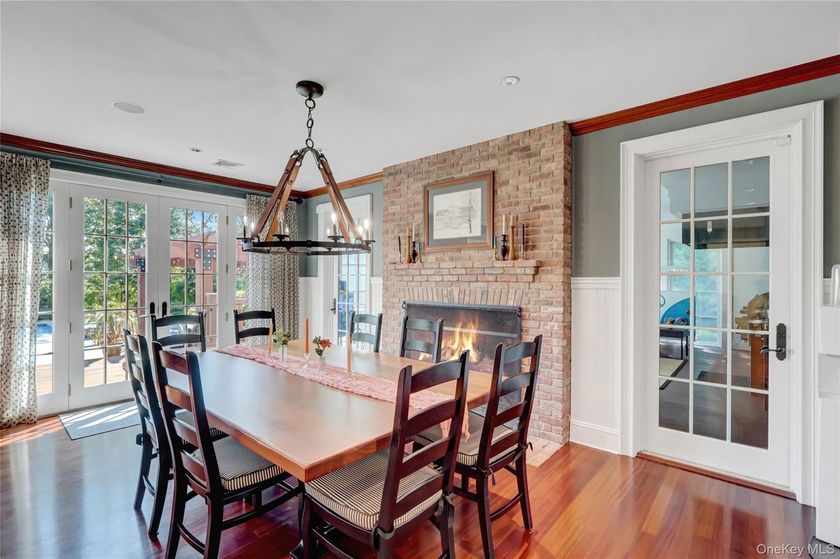 Dining room, Fireplace, Interior, Pendant Lights, Recessed Lighting, Stone Walls, Wood Texture Flooring