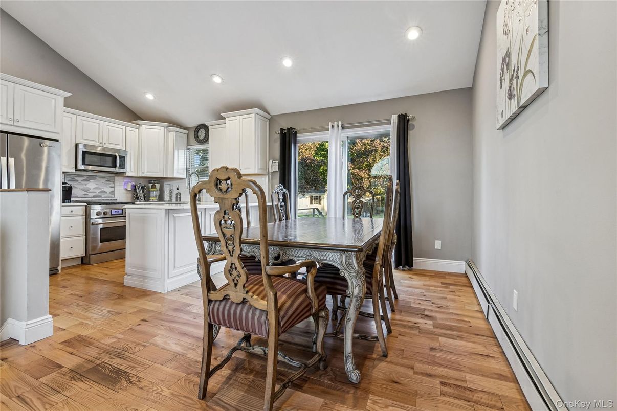 Dining room, Interior, Kitchen, Recessed Lighting, Stainless Steel Appliances, Wood Texture Flooring