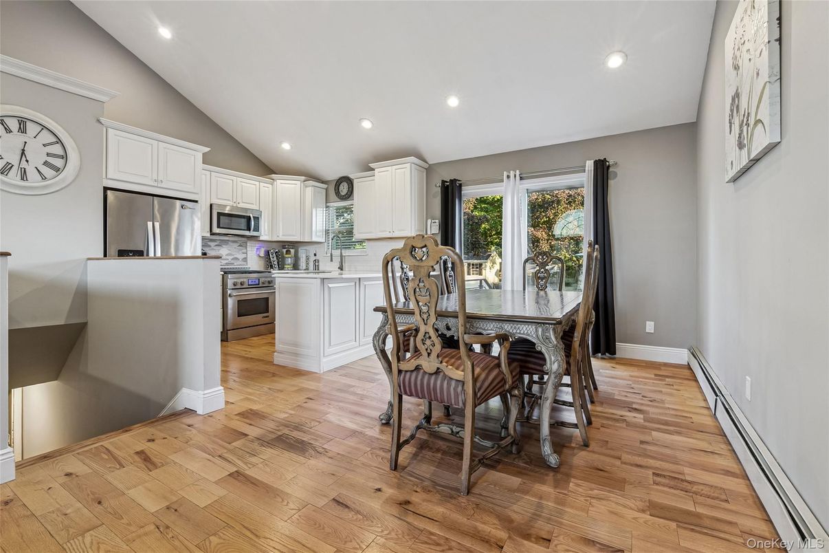 Dining room, Interior, Kitchen, Recessed Lighting, Stainless Steel Appliances, Wood Texture Flooring