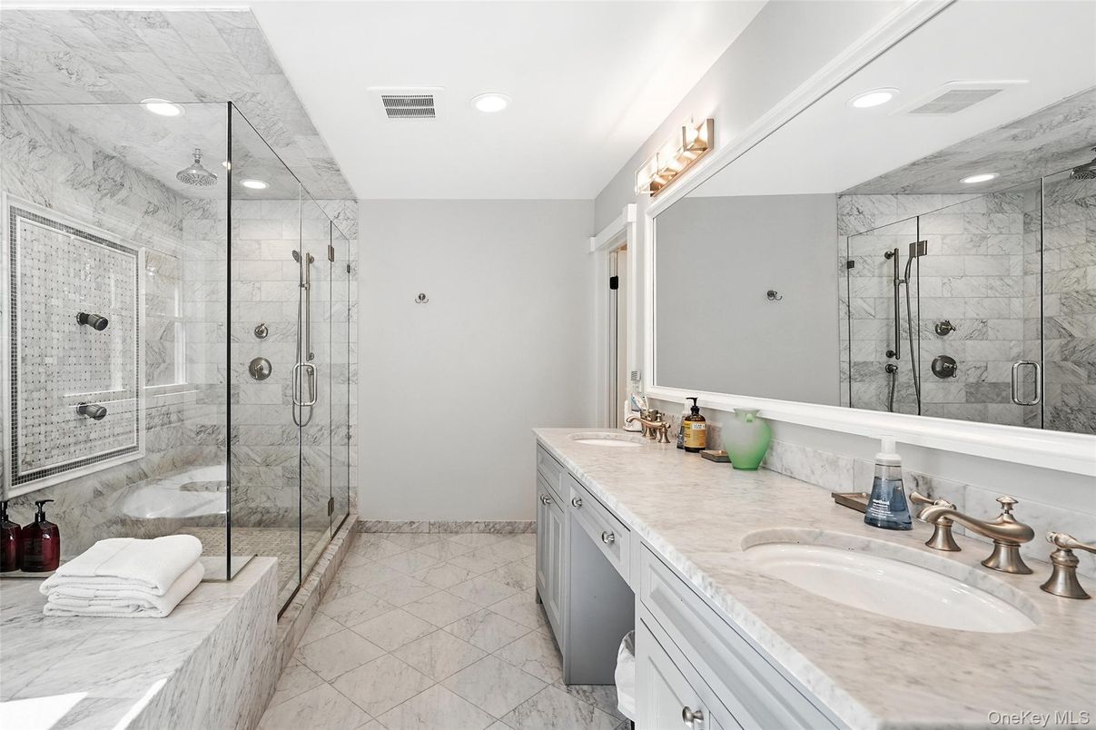 Bathroom, Dual Sink Vanities, Glass Shower, Interior, Marble, Marble Walls, Recessed Lighting